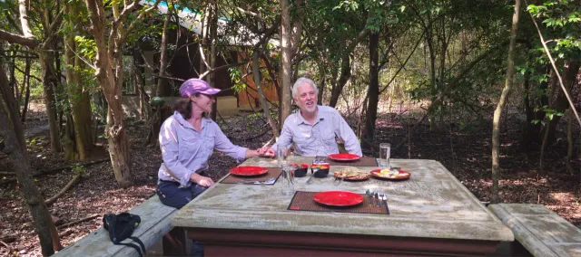 A couple at lunch at a table in the garden